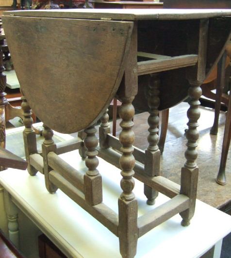 Appraisal: A th century and later oak drop flap table the