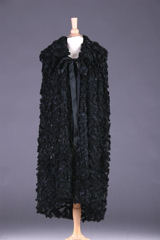 Appraisal: ISABEL CANOVAS BLACK LACE AND SATIN RIBBON CAPE s Isabel