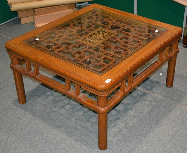 Appraisal: A Chinese elm square coffee tablewith fret work design under