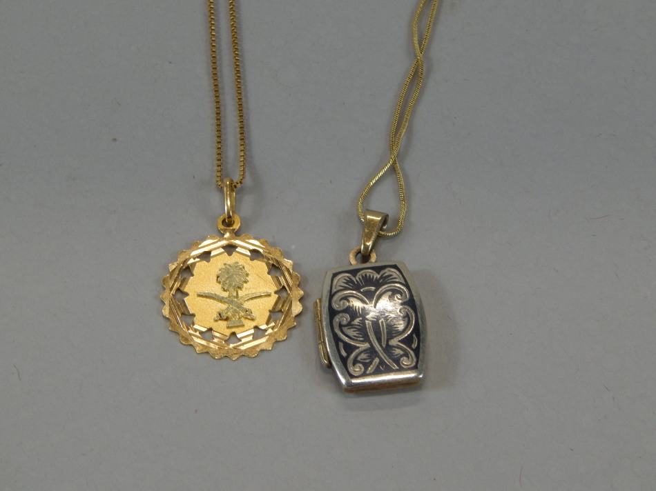 Appraisal: A pendant of star shaped part pierced outline centred by