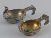 Appraisal: Two Russian silver gilt kovshi decorated with scrolling floral shaded