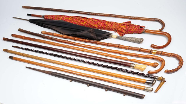 Appraisal: A collection of canes walking sticks and umbrellasto include a