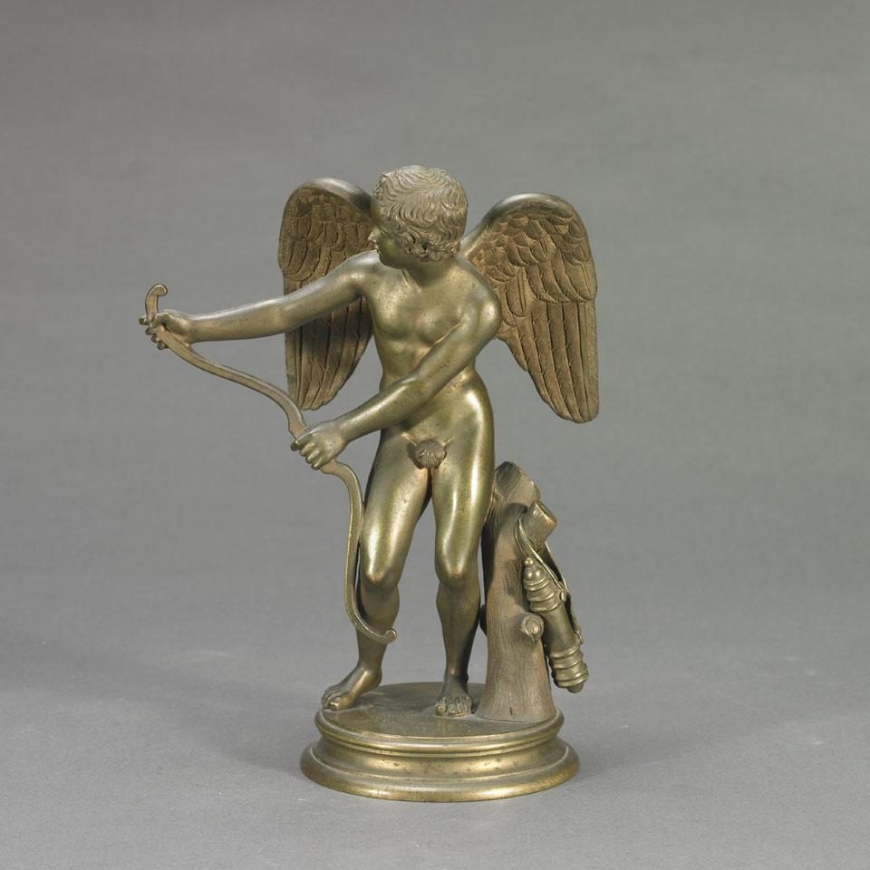 Appraisal: Patinated and Gilt Bronze Figure of Cupid c with tree