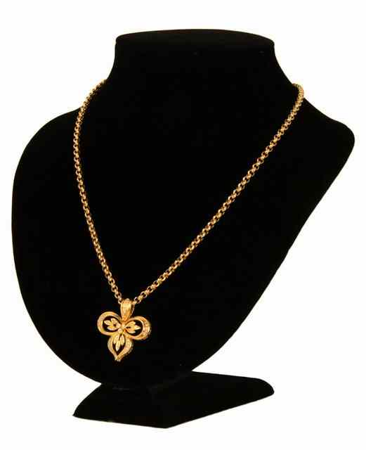 Appraisal: A diamond set ct yellow gold trefoil pendant on heavy