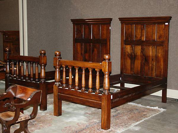 Appraisal: A pair of English Baroque style oak paneled beds composed