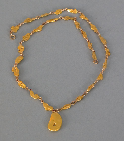 Appraisal: K yellow gold nugget necklace with drop nugget containing a