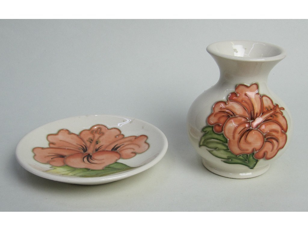 Appraisal: Moorcroft small 'Hibiscus' vase and similar dish on ivory ground