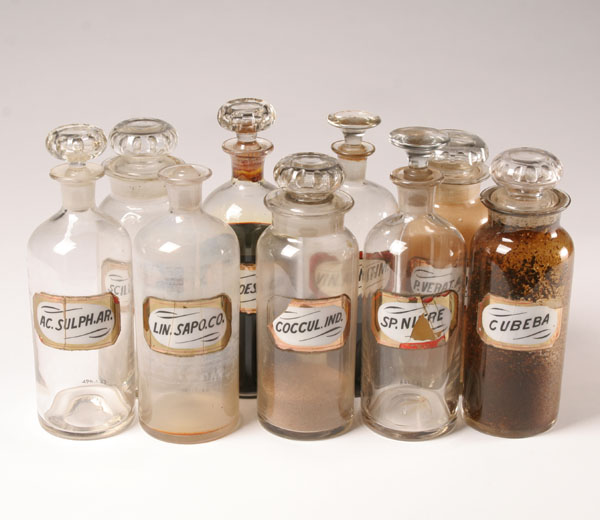 Appraisal: Stoppered glass pharmacy bottles with glass labels Tallest H Minor