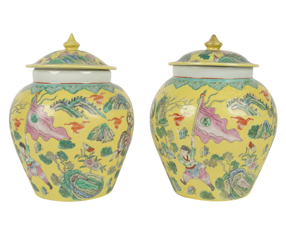 Appraisal: PAIR OF CHINESE YELLOW GLAZED CERAMIC COVERED URNSthe exterior depicting