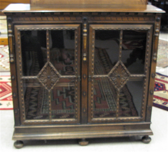 Appraisal: WALNUT AND MAHOGANY CABINET BOOKCASE Kittinger Furniture Co New York