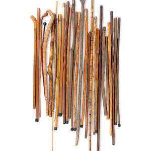 Appraisal: A Large Collection of Carved Canes and Walking Sticks Length