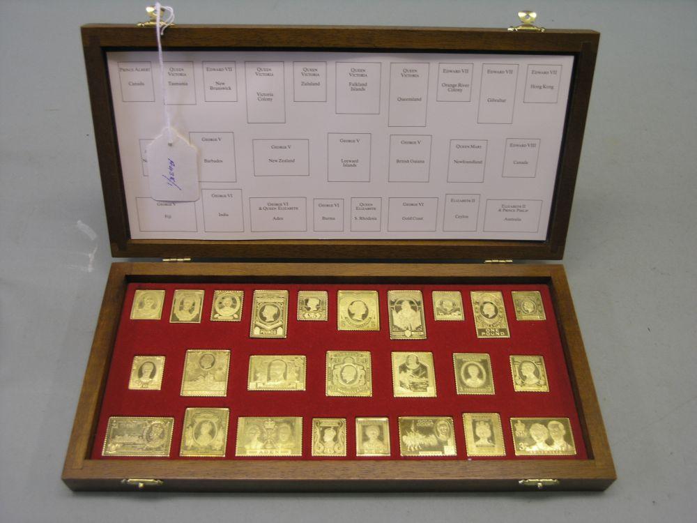 Appraisal: A cased collection of twenty-five Sterling silver ingots 'Royal Stamps