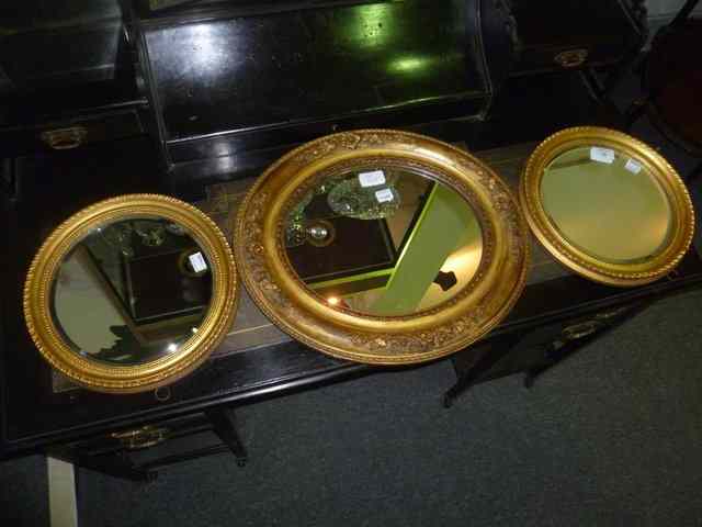 Appraisal: A PAIR OF TH CENTURY GILT FRAME CIRCULAR MIRRORS with