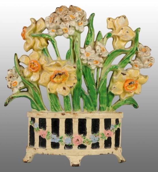 Appraisal: Cast Iron Narcissus Flower Doorstop Description Made by Hubley Numbered