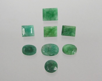 Appraisal: A Group of Forest Green Emeralds Containing four oval faceted