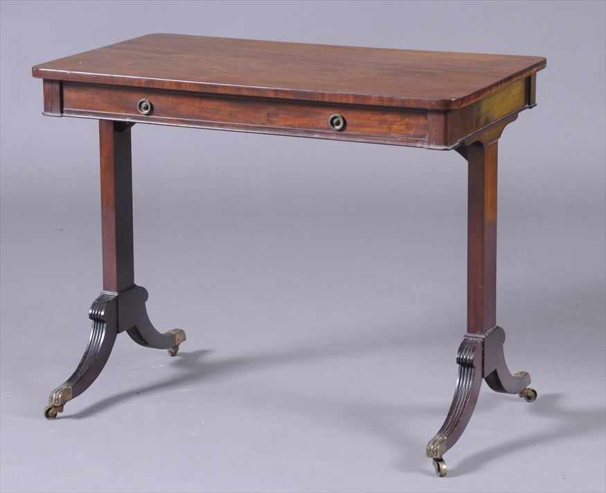 Appraisal: REGENCY MAHOGANY LIBRARY TABLE The top with rounded corners above