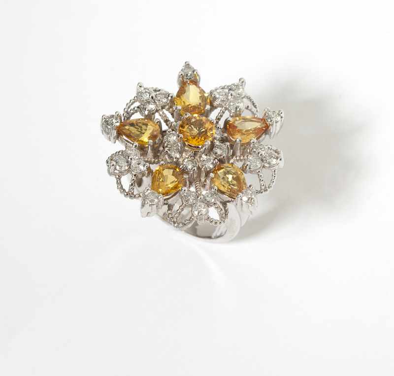 Appraisal: A yellow sapphire diamond and white gold snowflake ring K