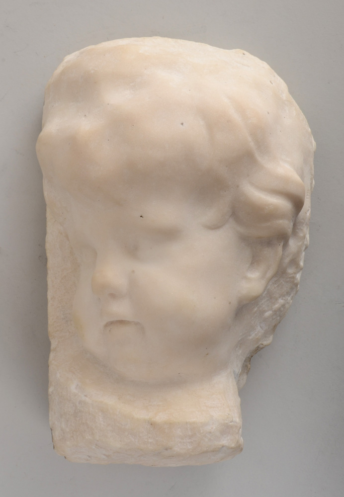 Appraisal: ROCOCO STYLE CARVED CARARA MARBLE RELIEF HEAD OF A PUTTO