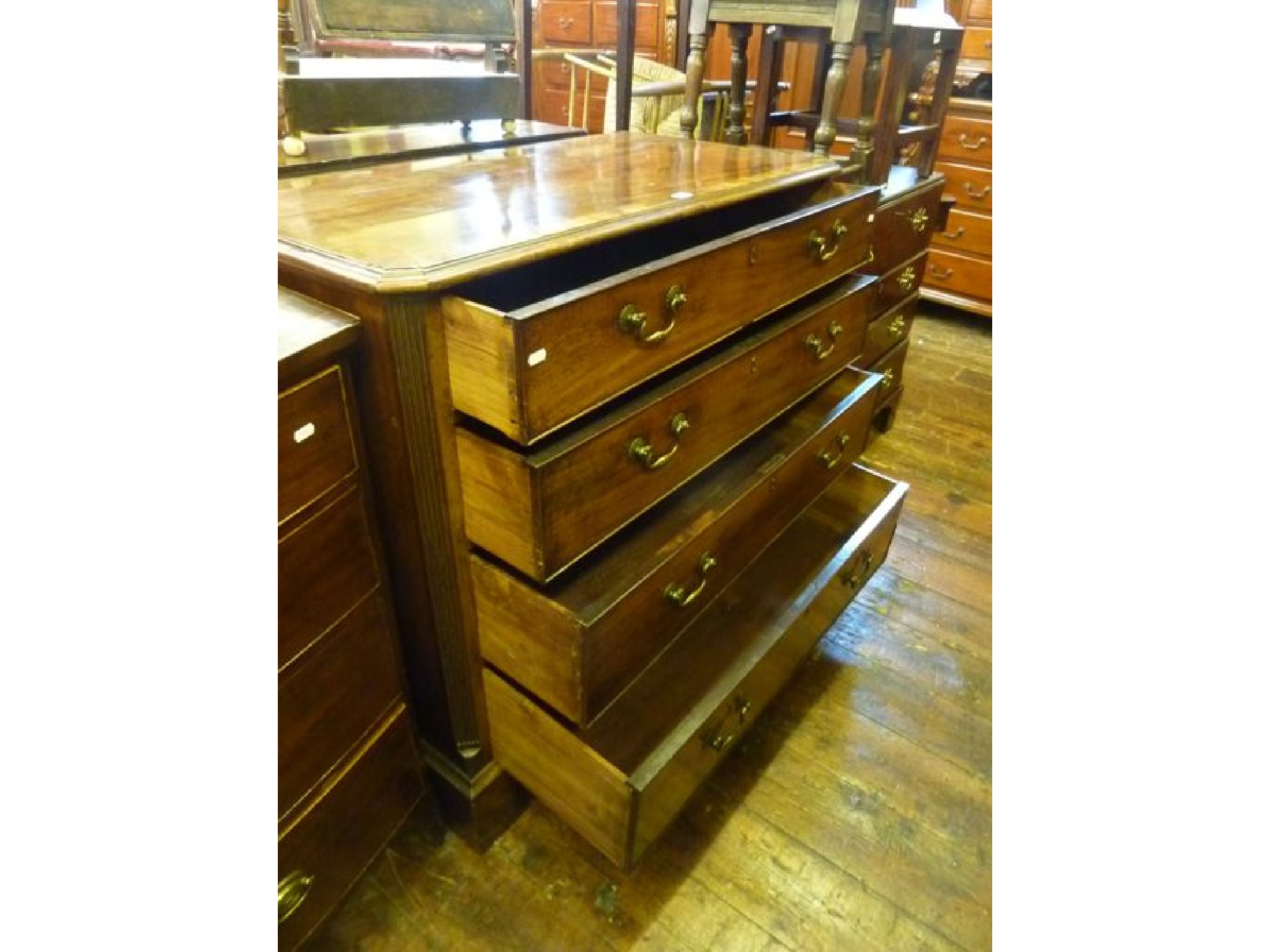 Appraisal: A Georgian mahogany chest of four long graduated drawers raised