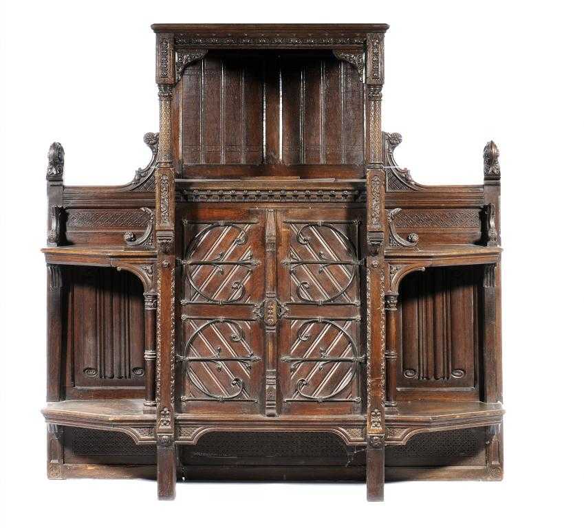 Appraisal: A VICTORIAN GOTHIC CARVED OAK CUPBOARD with canopied top and