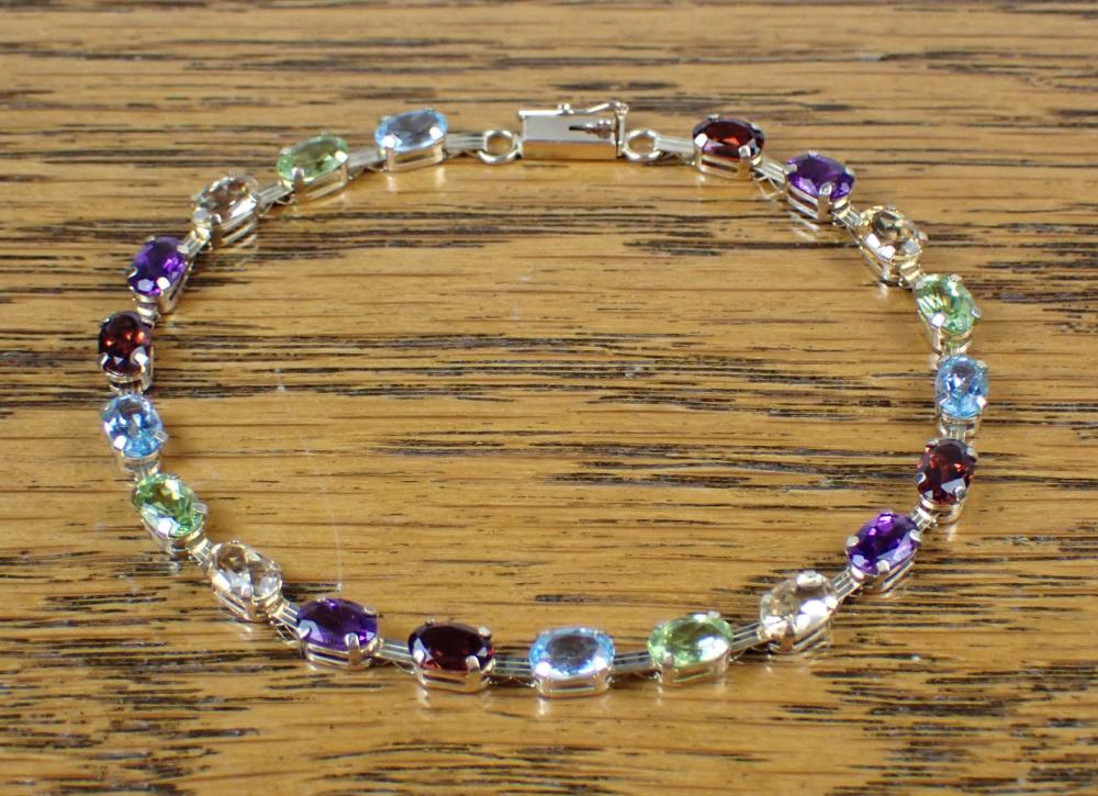 Appraisal: MULTI COLOR GEMSTONE AND YELLOW GOLD BRACELET The - k