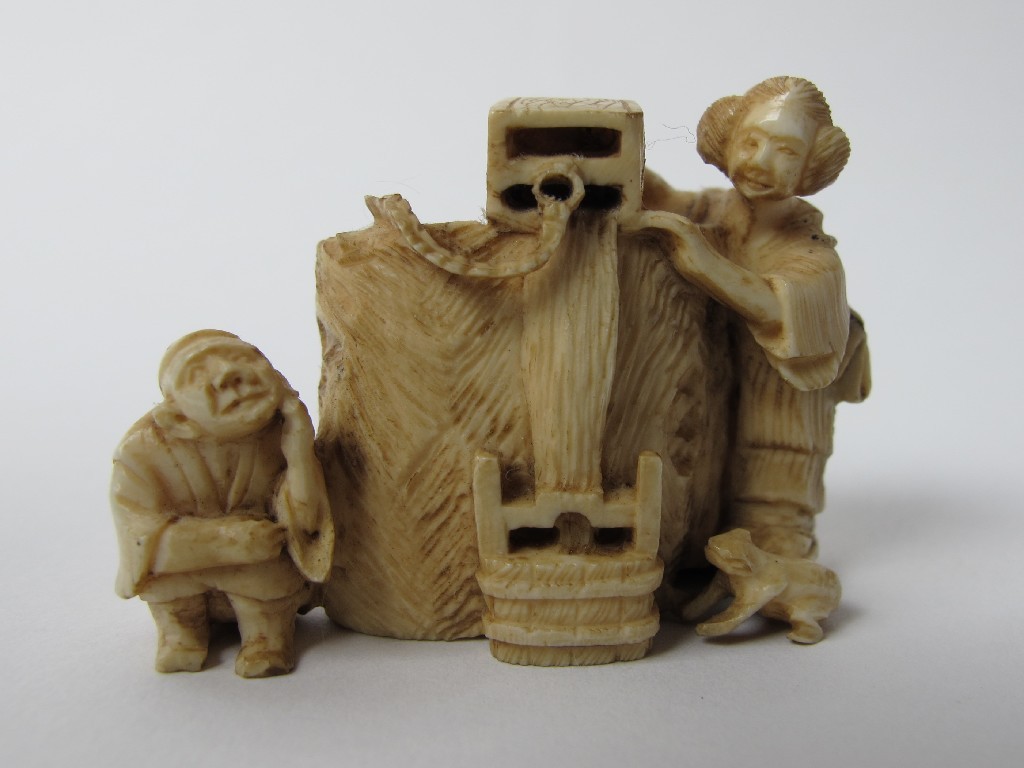 Appraisal: A Japanese carved ivory netsuke of a woman drawing water