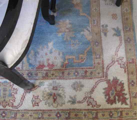 Appraisal: HAND KNOTTED ORIENTAL CARPET Indo-Persian Oushak design on light blue