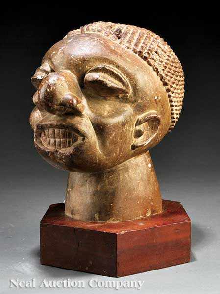 Appraisal: A Sierra Leone Carved Stone Head Mahen Yafe thick strong