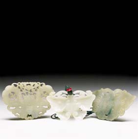 Appraisal: THREE JADE BUTTERFLY PENDANTS Three antique Chinese carved jade butterfly