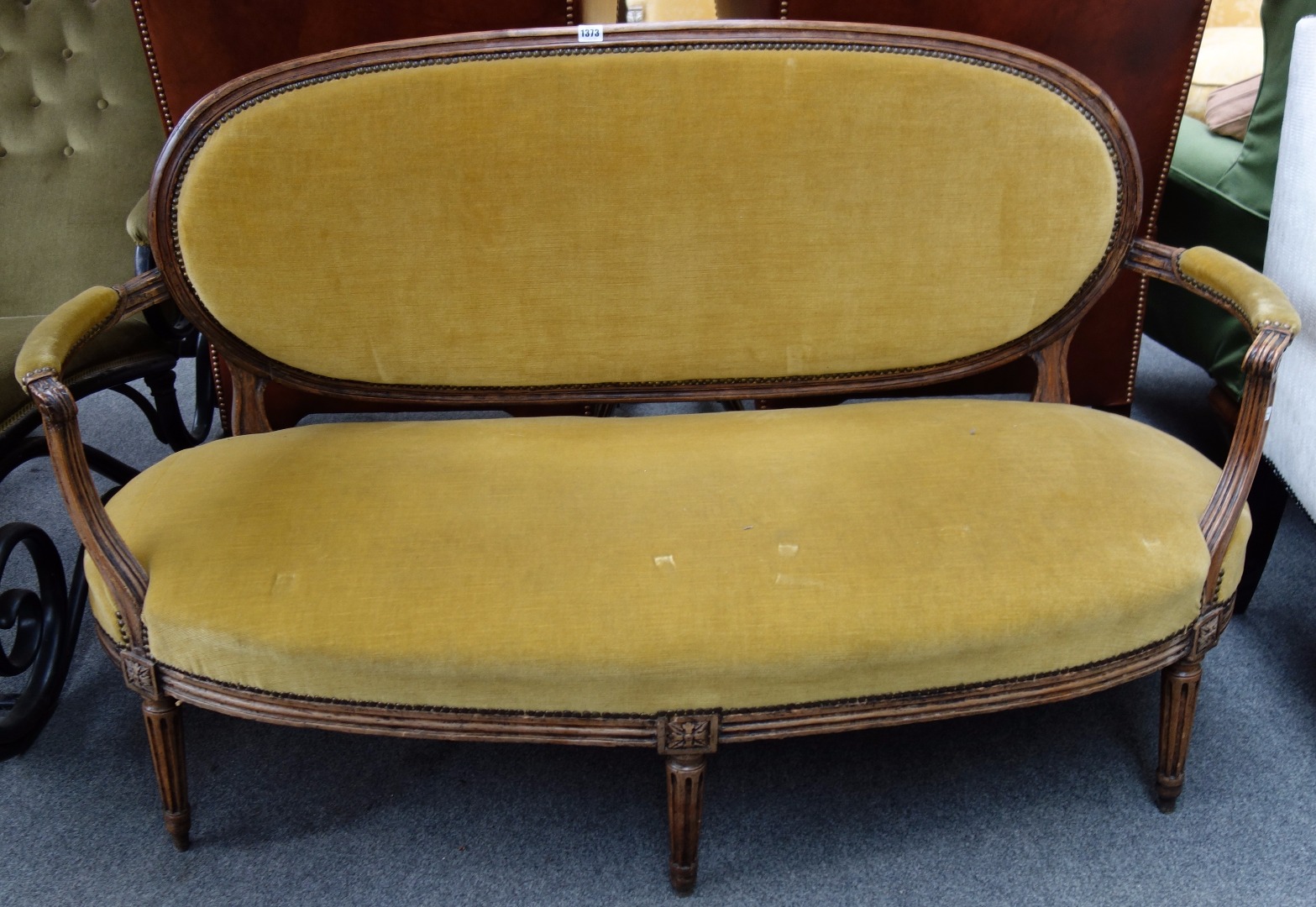 Appraisal: A Louis XV style stained beech open arm sofa with