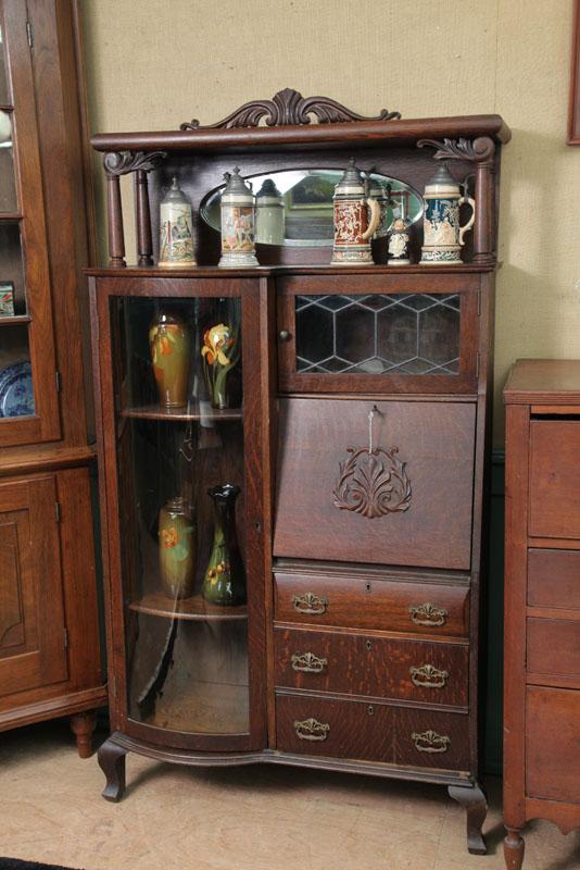 Appraisal: SIDE BY SIDE SECRETARY BOOKCASE Oak having a carved and