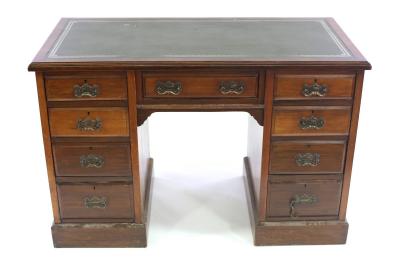 Appraisal: An Edwardian pedestal desk fitted nine drawers around a kneehole