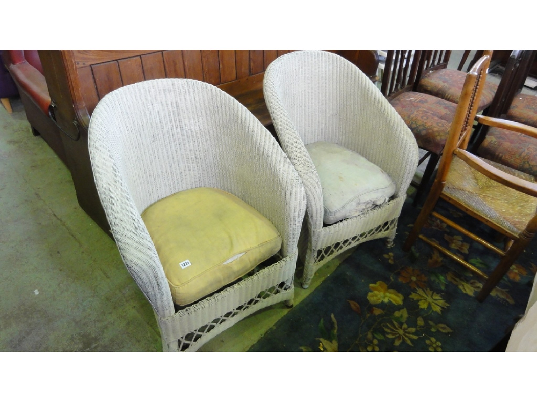 Appraisal: A pair of Lloyd Loom tub chairs with downswept arms