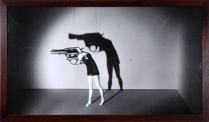 Appraisal: LAURIE SIMMONS b WALKING GUN Black and white photograph x