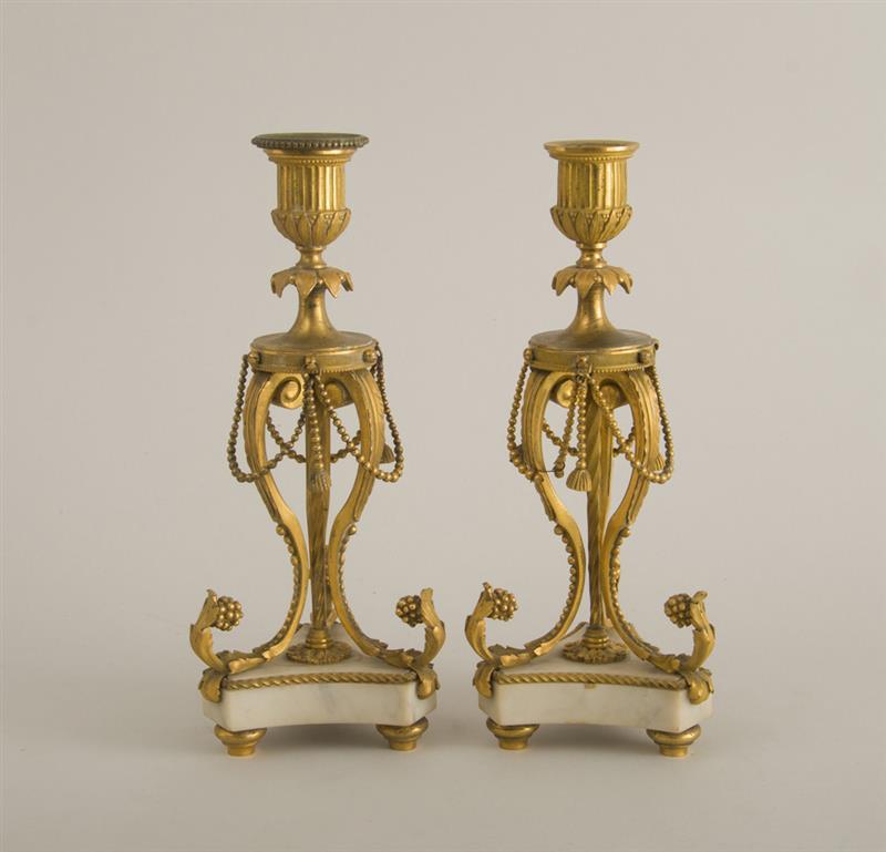 Appraisal: PAIR OF LOUIS XVI ORMOLU CANDLESTICKS Each fluted urn and