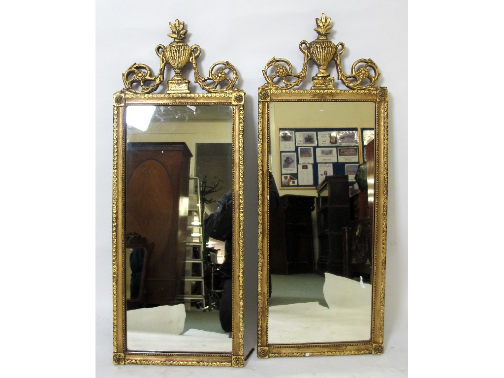 Appraisal: A pair of th Century giltwood wall mirrors with urn