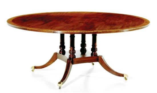 Appraisal: Regency style inlaid mahogany circular dining table banded top supported