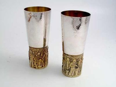 Appraisal: Two similar modern Limited Edition parcel gilt beakers commissioned by