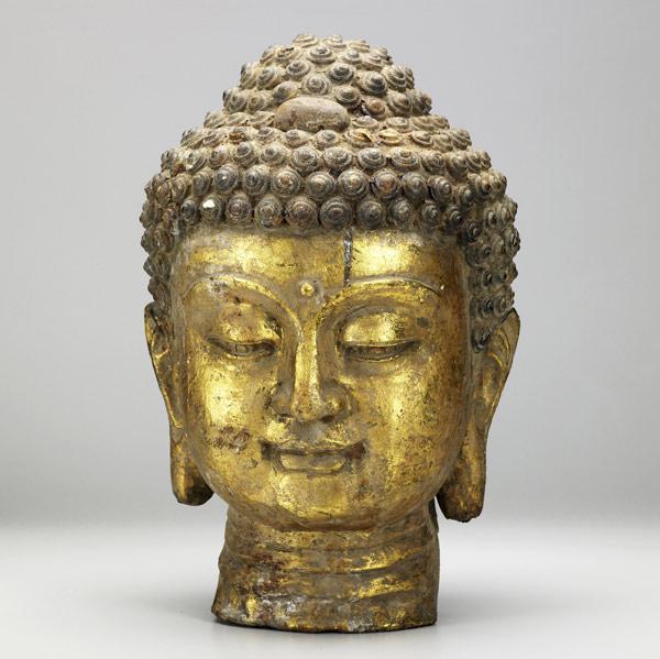 Appraisal: CAST IRON BUDDHA Southeastern Asian origin with gilded highlights th