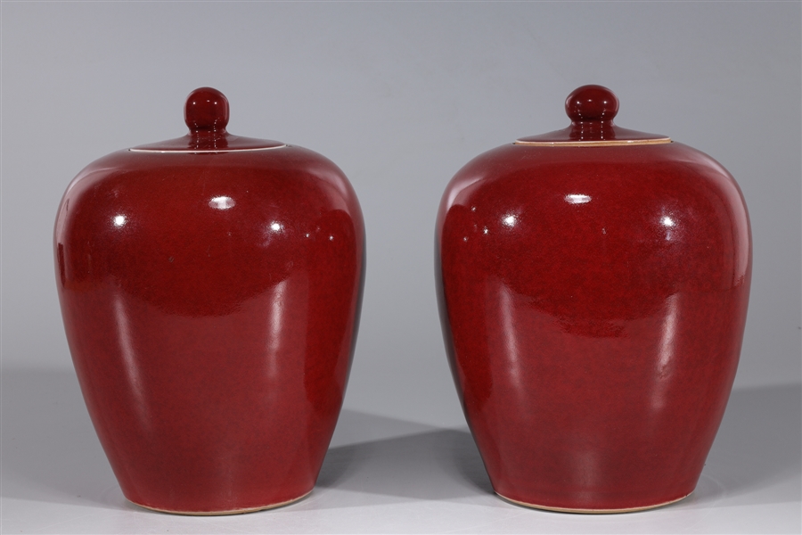 Appraisal: Pair of Chinese porcelain sang de boeuf covered jars overall