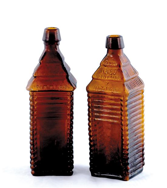 Appraisal: St Drake log cabin bitters bottles circa rich brown colored