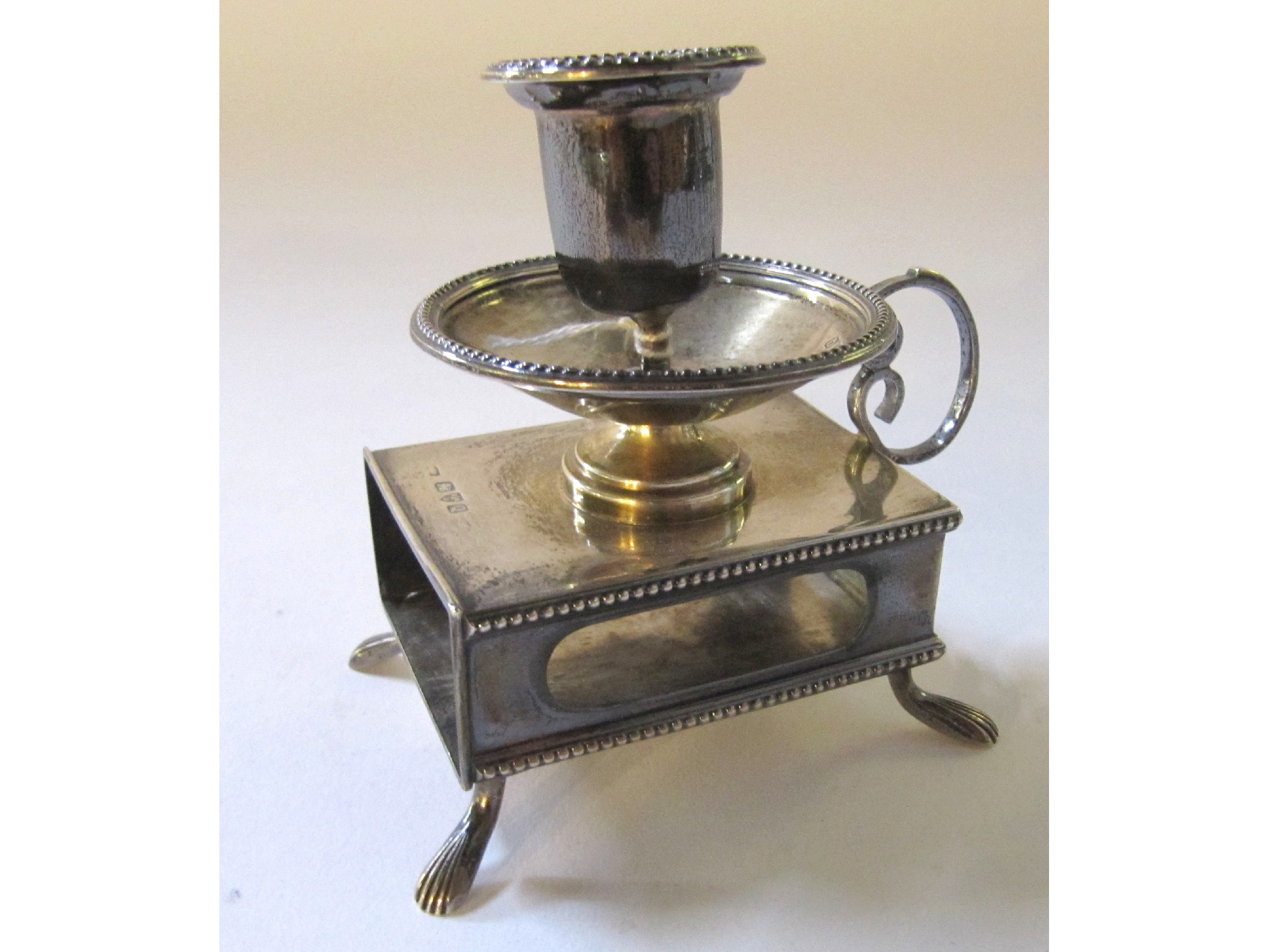 Appraisal: A silver table top matchbox holder candlestick Chester