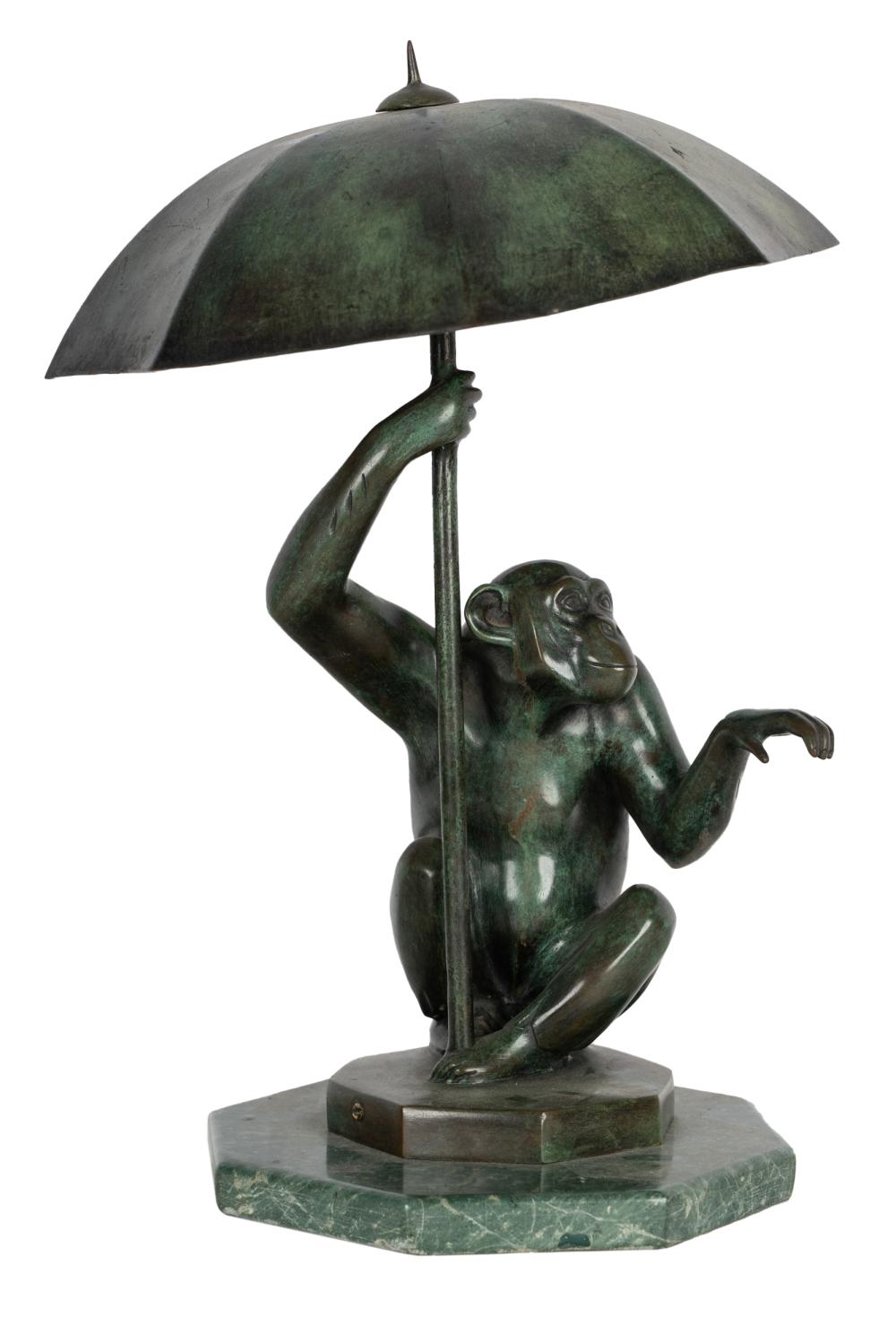 Appraisal: BRONZE MONKEY TABLE LAMPfitted with two sockets beneath the integral