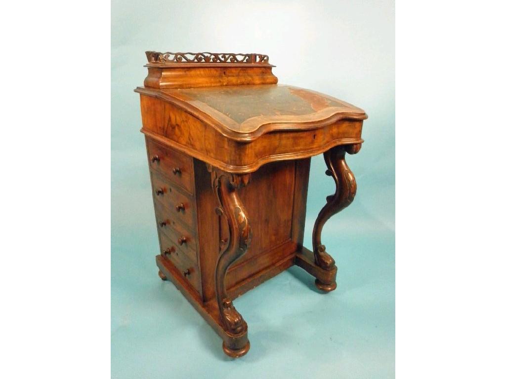 Appraisal: A Victorian walnut davenport the top with a pierced back