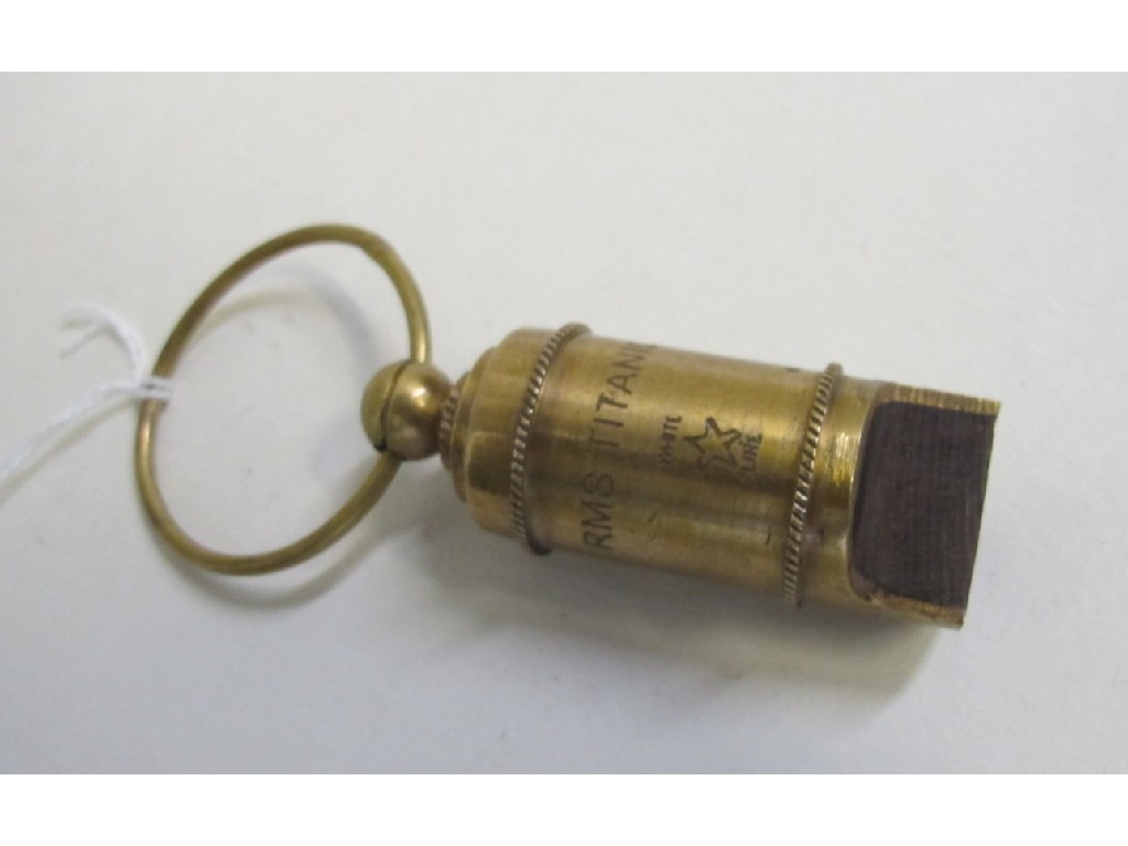 Appraisal: Brass whistle engraved R M S Titanic