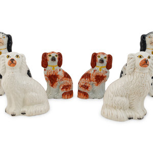 Appraisal: Three Pairs of English Staffordshire Seated Spaniels TH TH CENTURY