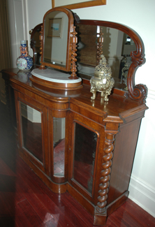 Appraisal: A VICTORIAN MAHOGANY SIDEBOARD The mirror back above a breakfront