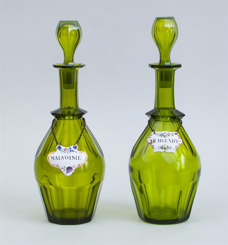 Appraisal: PAIR OF ENGLISH CUT GREEN-GLASS DECANTERS AND STOPPERS Together with