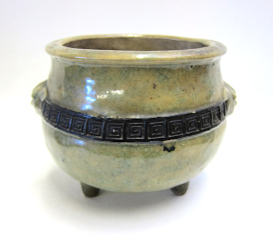 Appraisal: CHINESE POTTERY CENSOR tri-legged having repeating longevity design dark central