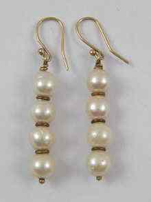 Appraisal: A pair of cultured pearl earrings with gold fittings drop